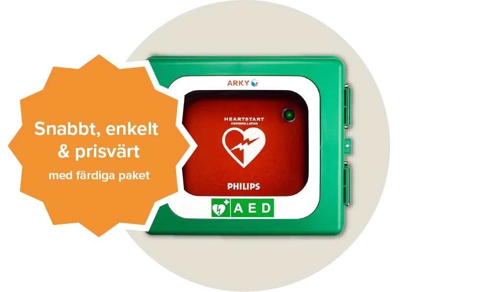 En röd väska för hjärtstartare från varumärket philips med ett vitt hjärta på ligger inlåst i ett grönt skåp för hjärtstartare. Etikett: Snabbt, enkelt & prisvärt med färdiga paket