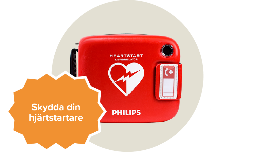 En röd väska för hjärtstartare med ett vitt hjärta på. Passar till Philips heartstart frx. Etikett: Skydda din hjärtstartare.